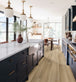 Laurel Reserve Cabana - Luxury Vinyl Flooring featured in a hale navy transitional kitchen